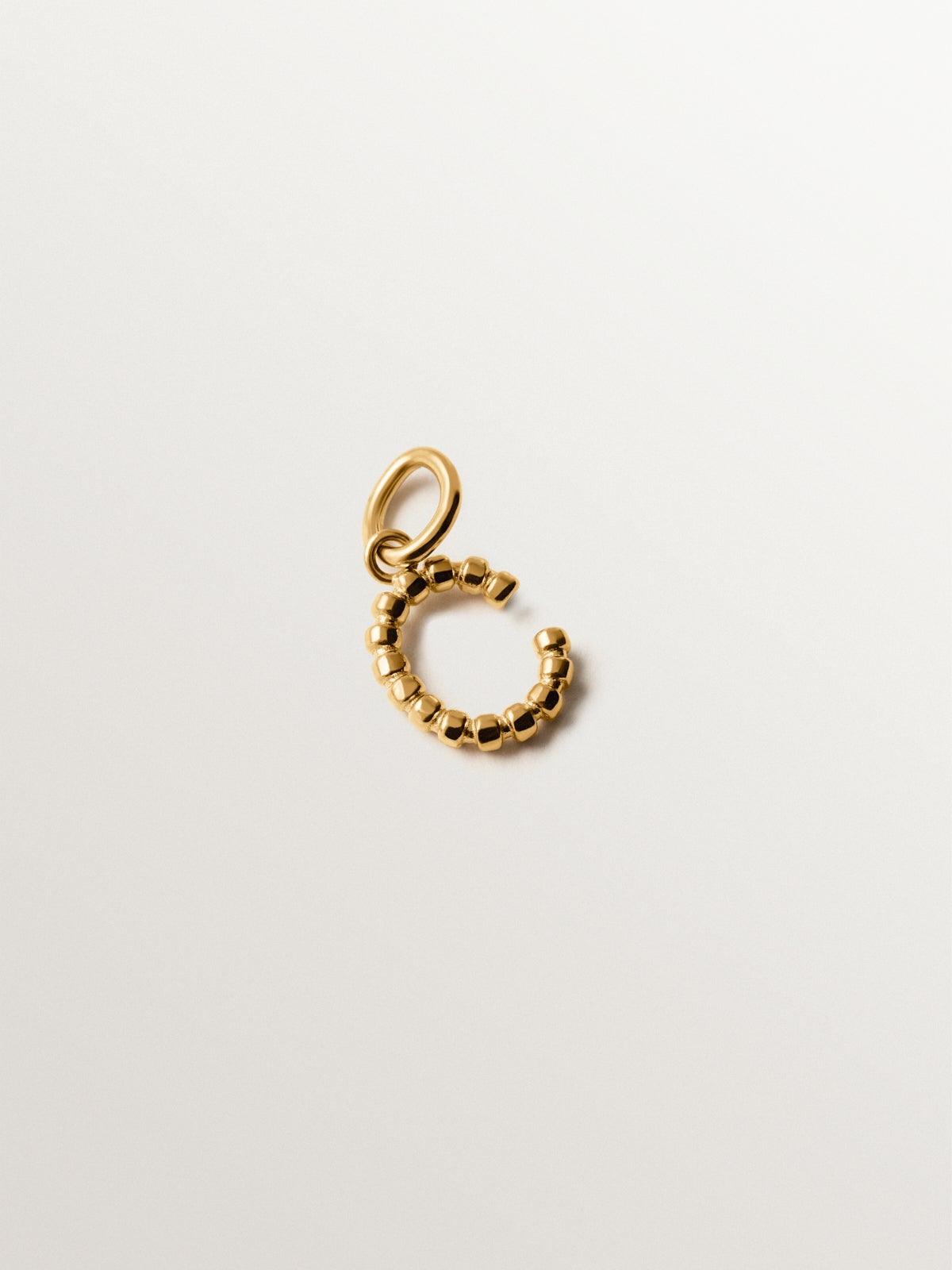 925 silver charm plated in 18K yellow gold with letter C and dial motifs