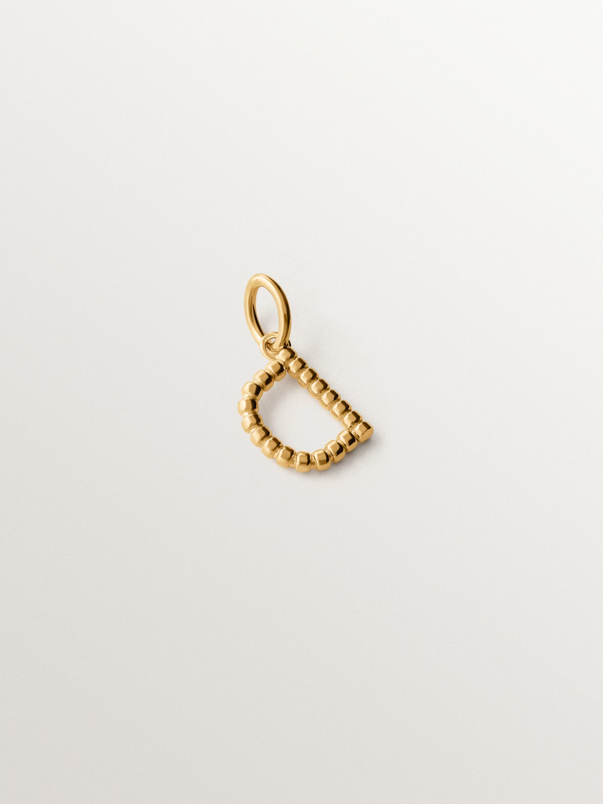 925 silver charm plated in 18K yellow gold with letter D and dial motifs
