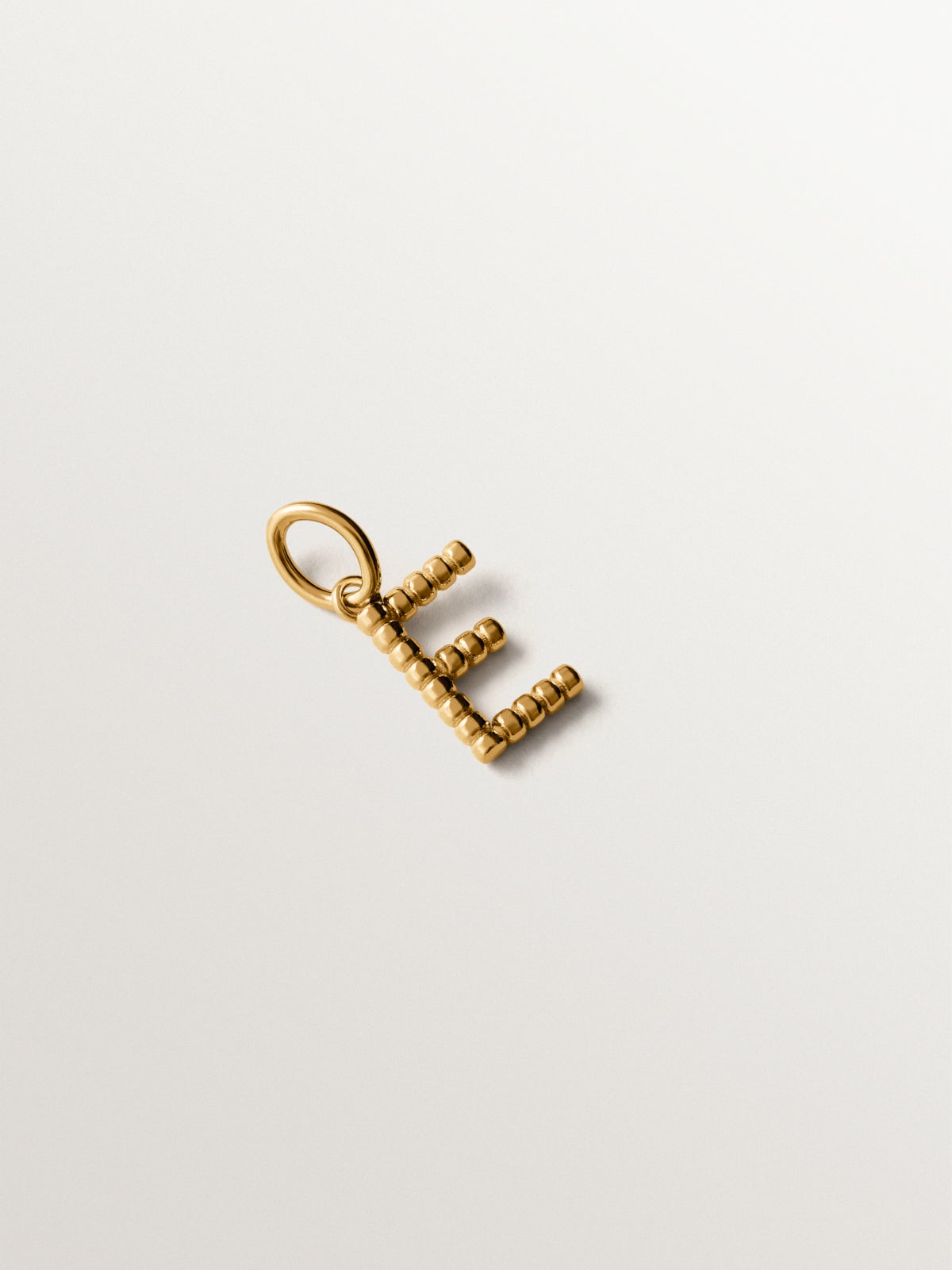 925 silver charm plated in 18K yellow gold with letter E and dial motifs