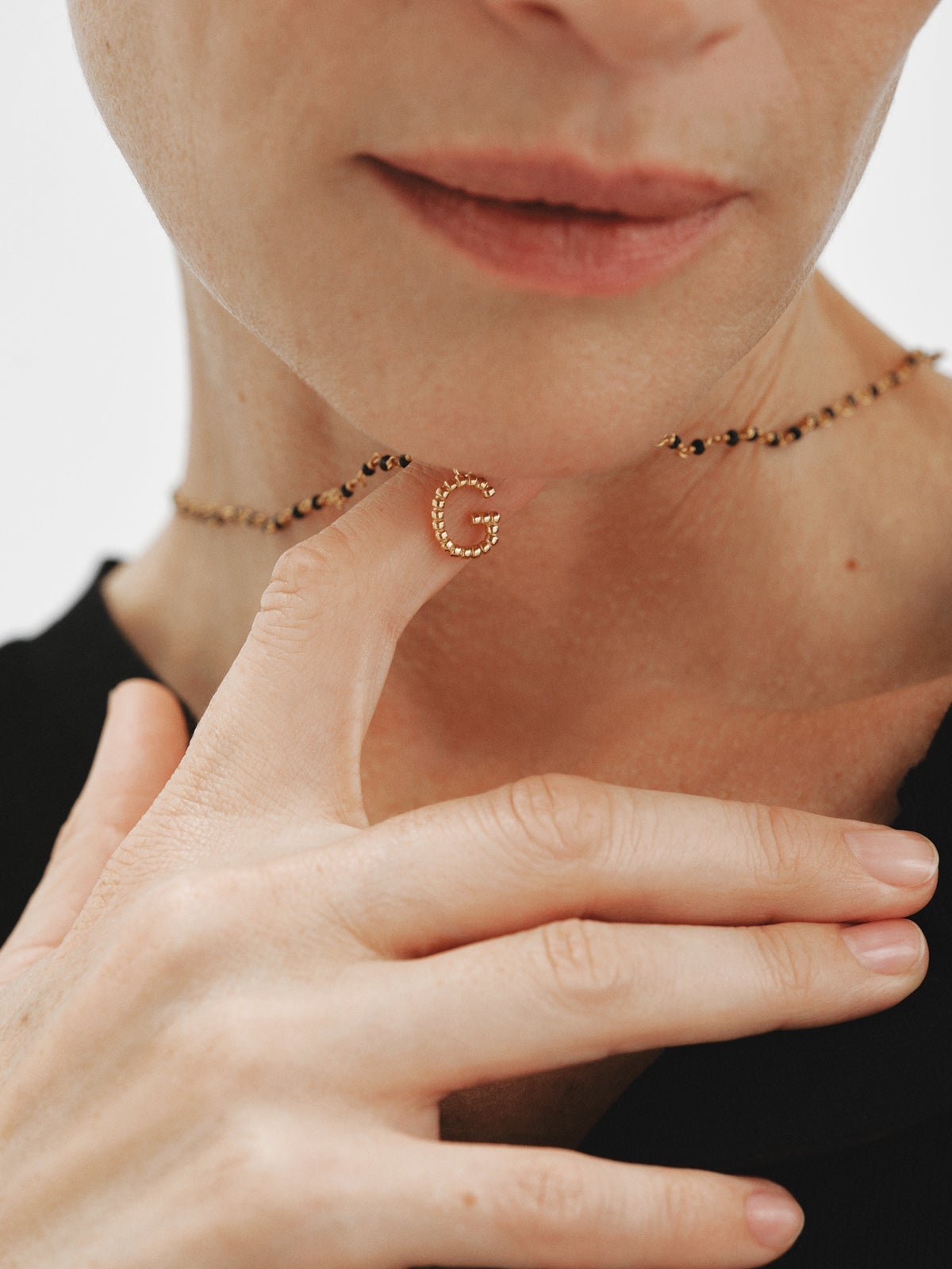 925 silver charm plated in 18K yellow gold with letter G and dial motifs