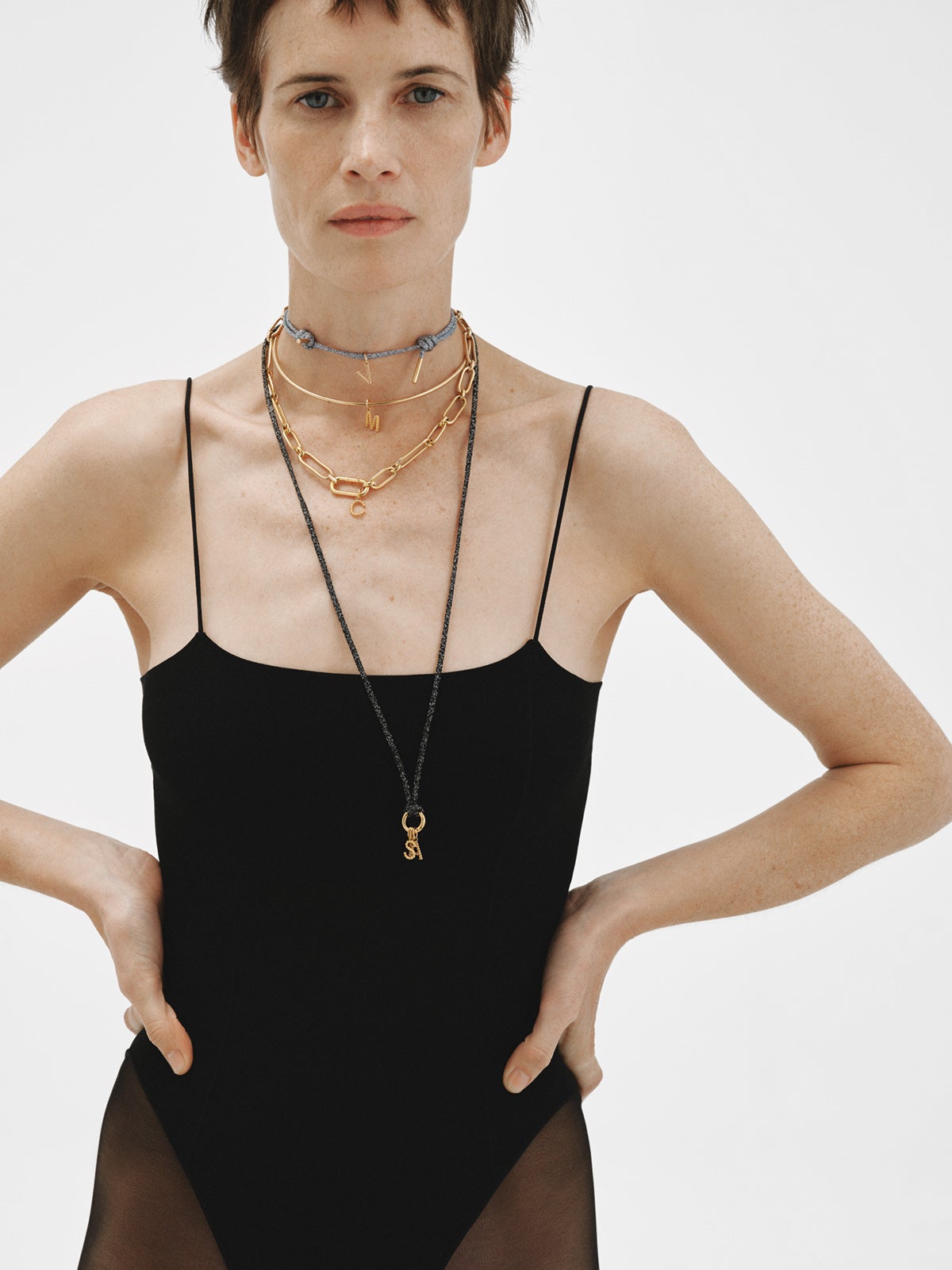 925 silver charm plated in 18K yellow gold with letter G and dial motifs