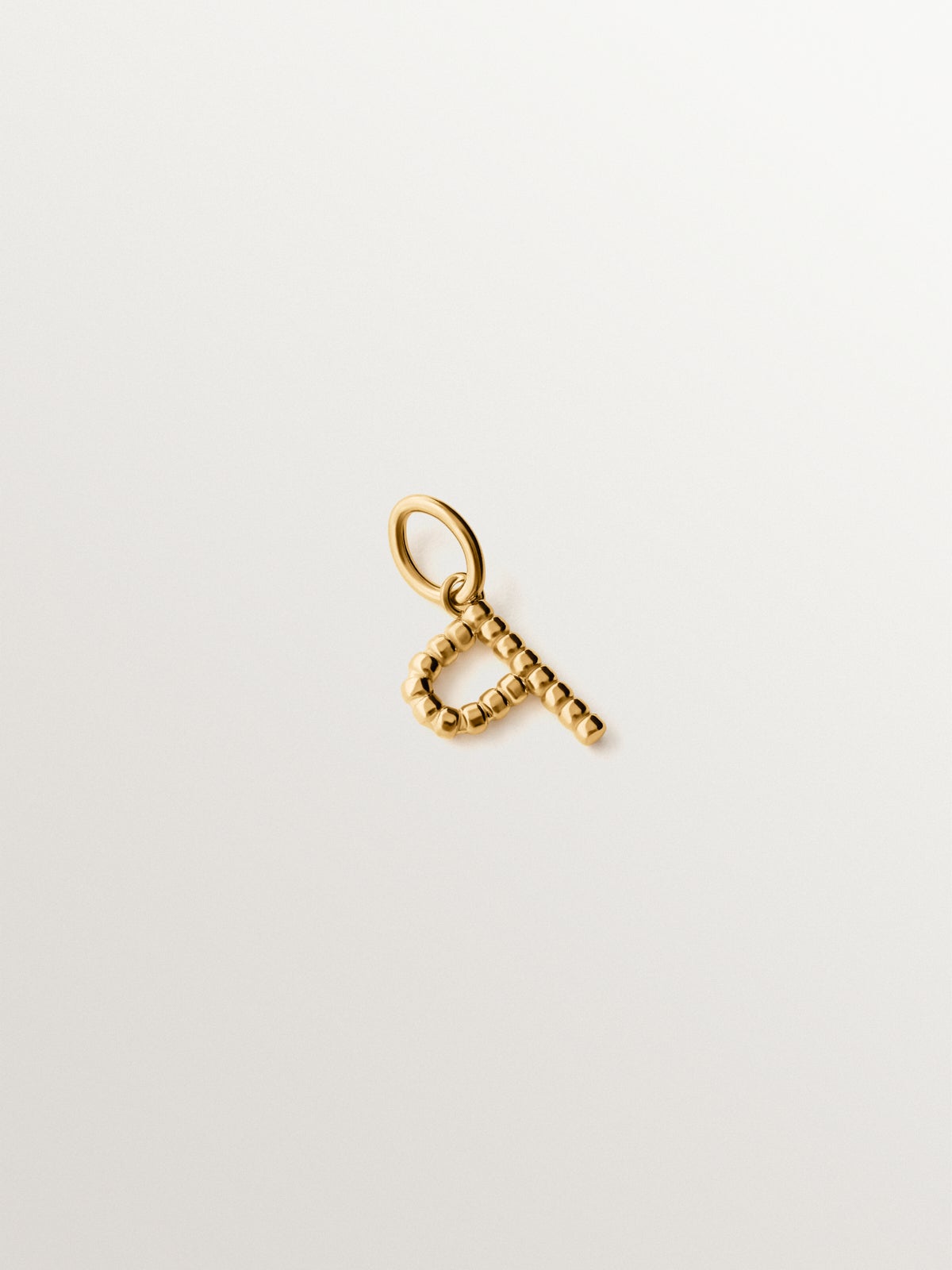 925 silver charm plated in 18K yellow gold with letter P and dial motifs
