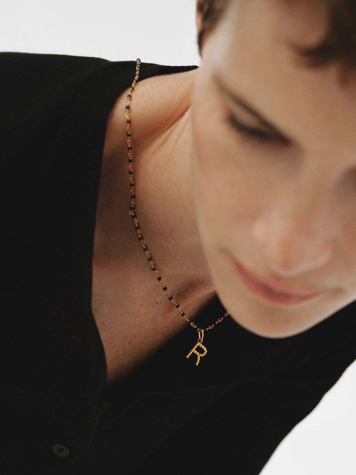 925 silver charm plated in 18K yellow gold with letter R and dial motifs