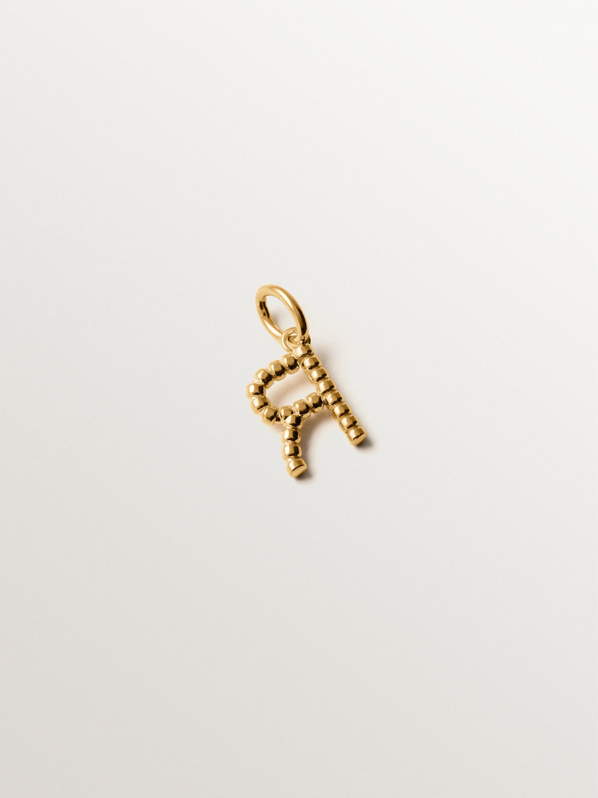 925 silver charm plated in 18K yellow gold with letter R and dial motifs