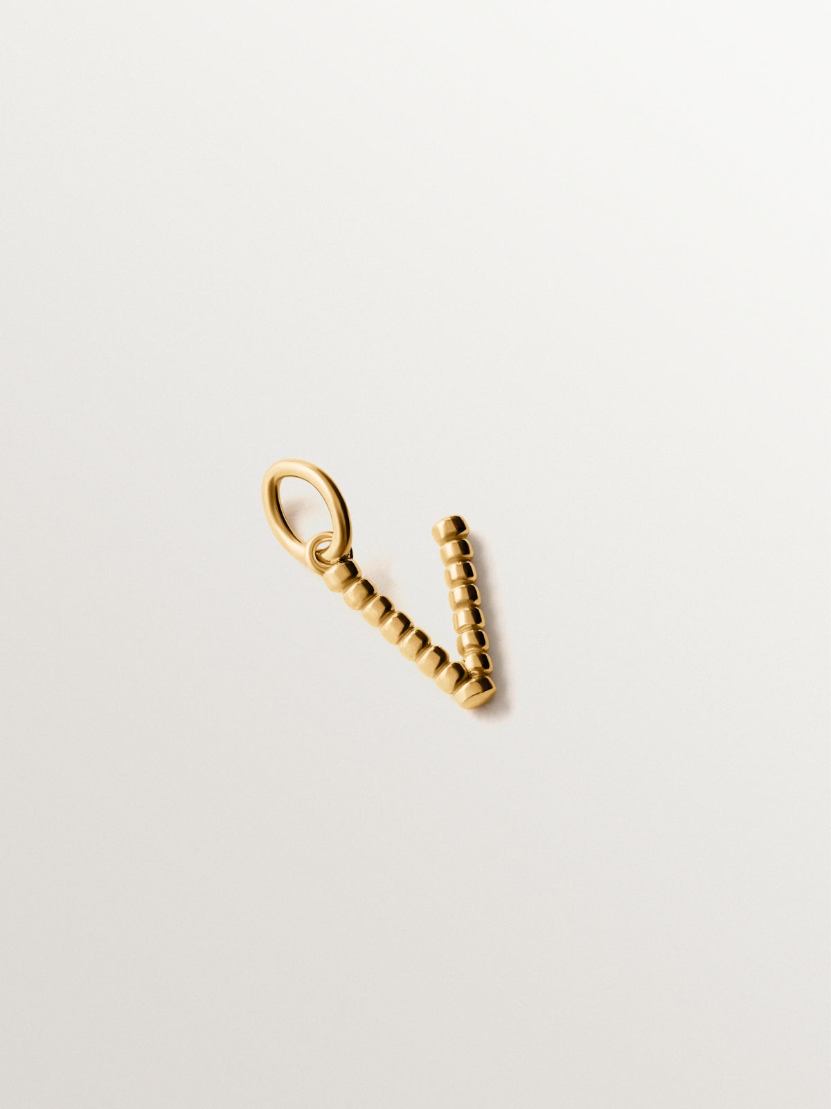 925 silver charm plated in 18K yellow gold with letter V and dial motifs