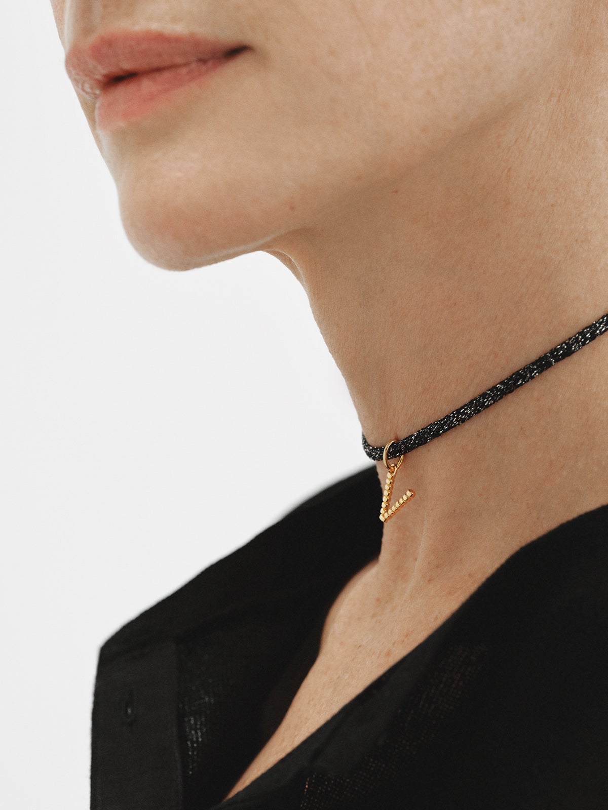 925 silver charm plated in 18K yellow gold with letter V and dial motifs