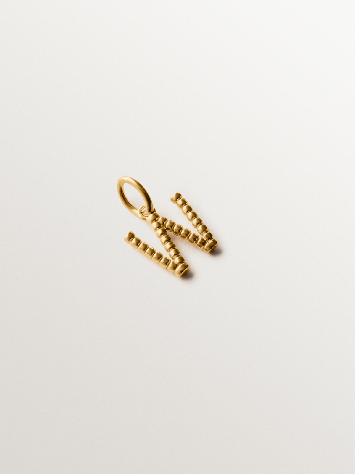 925 silver charm plated in 18K yellow gold with letter W and dial motifs