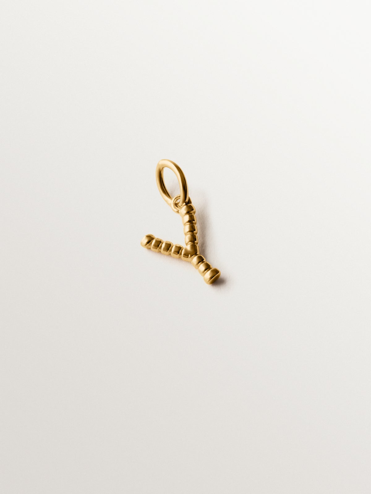 925 silver charm plated in 18K yellow gold with Y letter and dial motifs