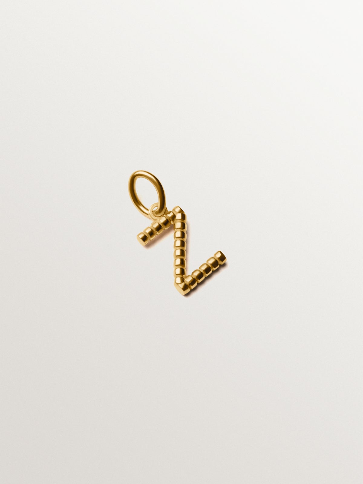 925 silver charm plated in 18K yellow gold with letter Z and dial motifs