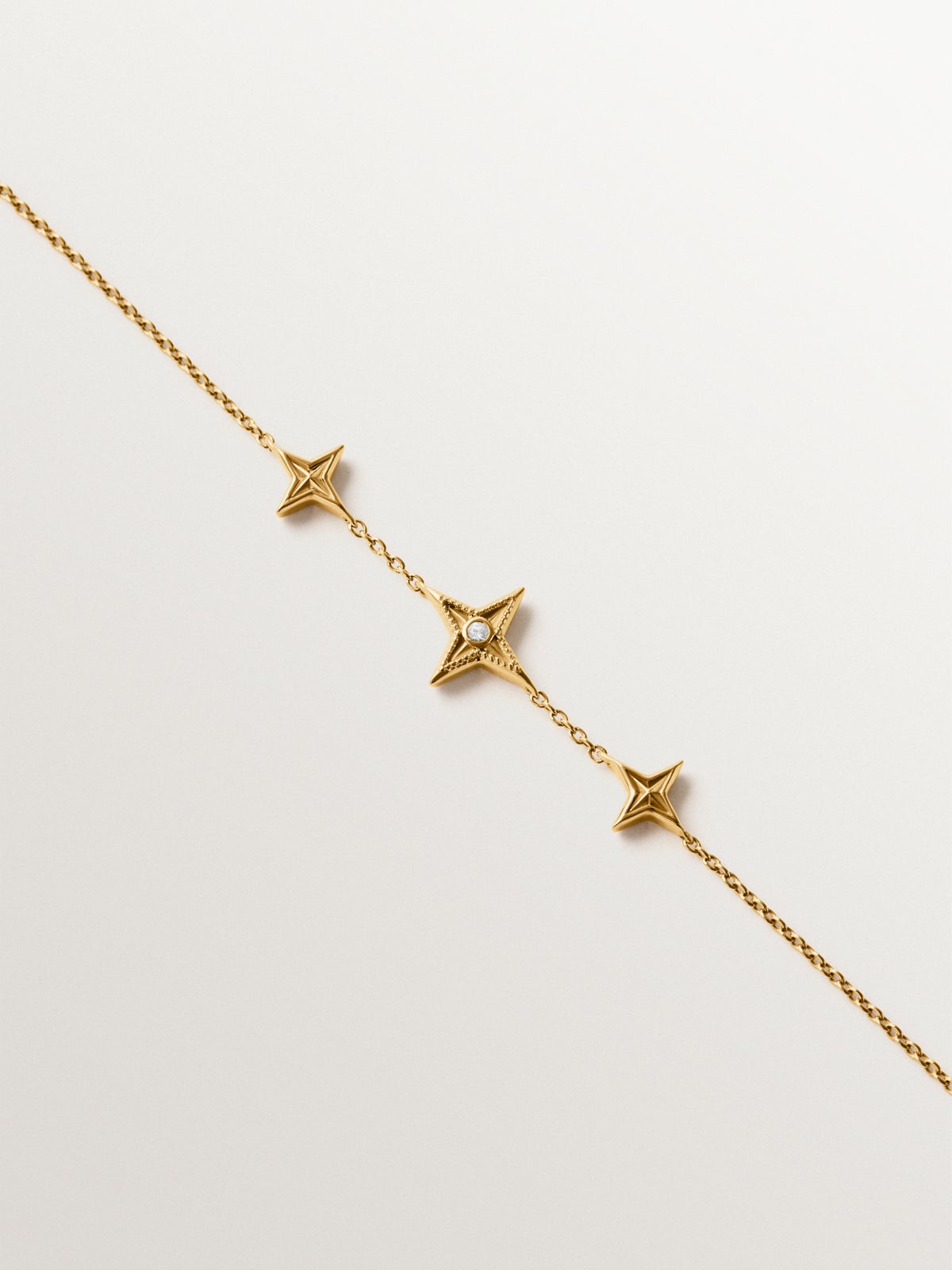 925 silver bracelet plated in 18K yellow gold with white topaz and star shape