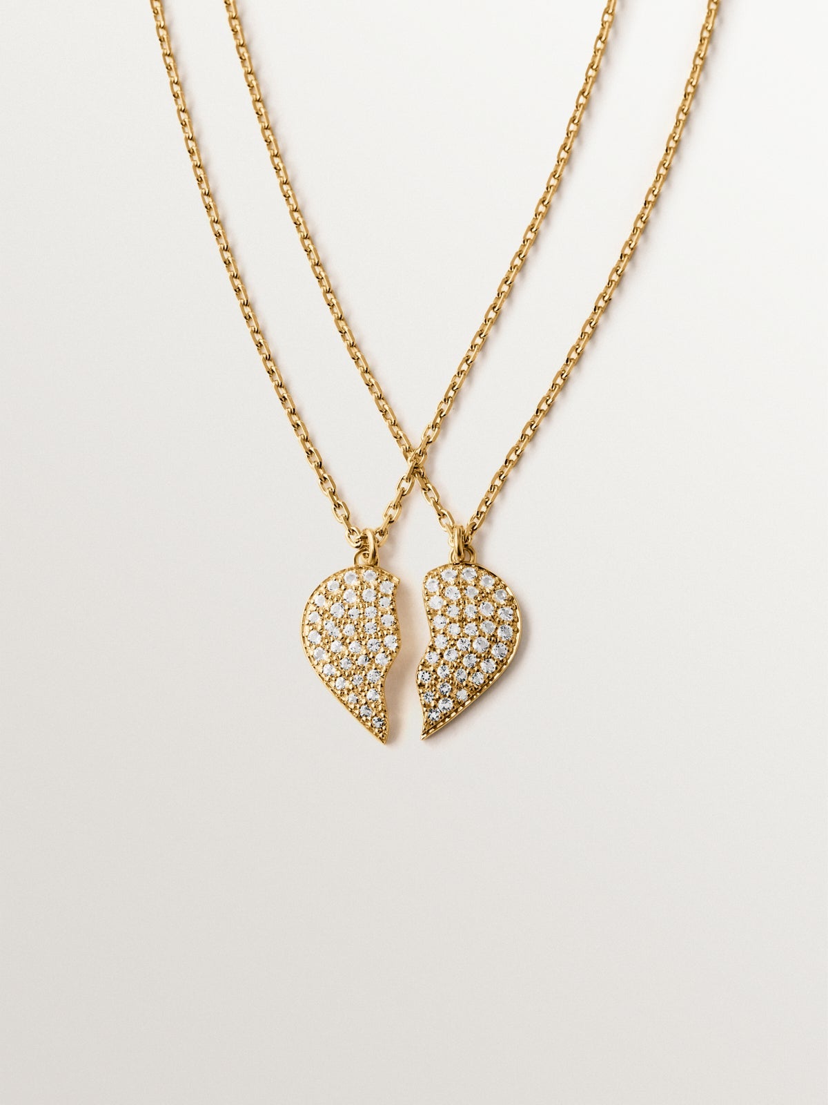 18K yellow gold plated silver pendant, white topaz and split heart shape