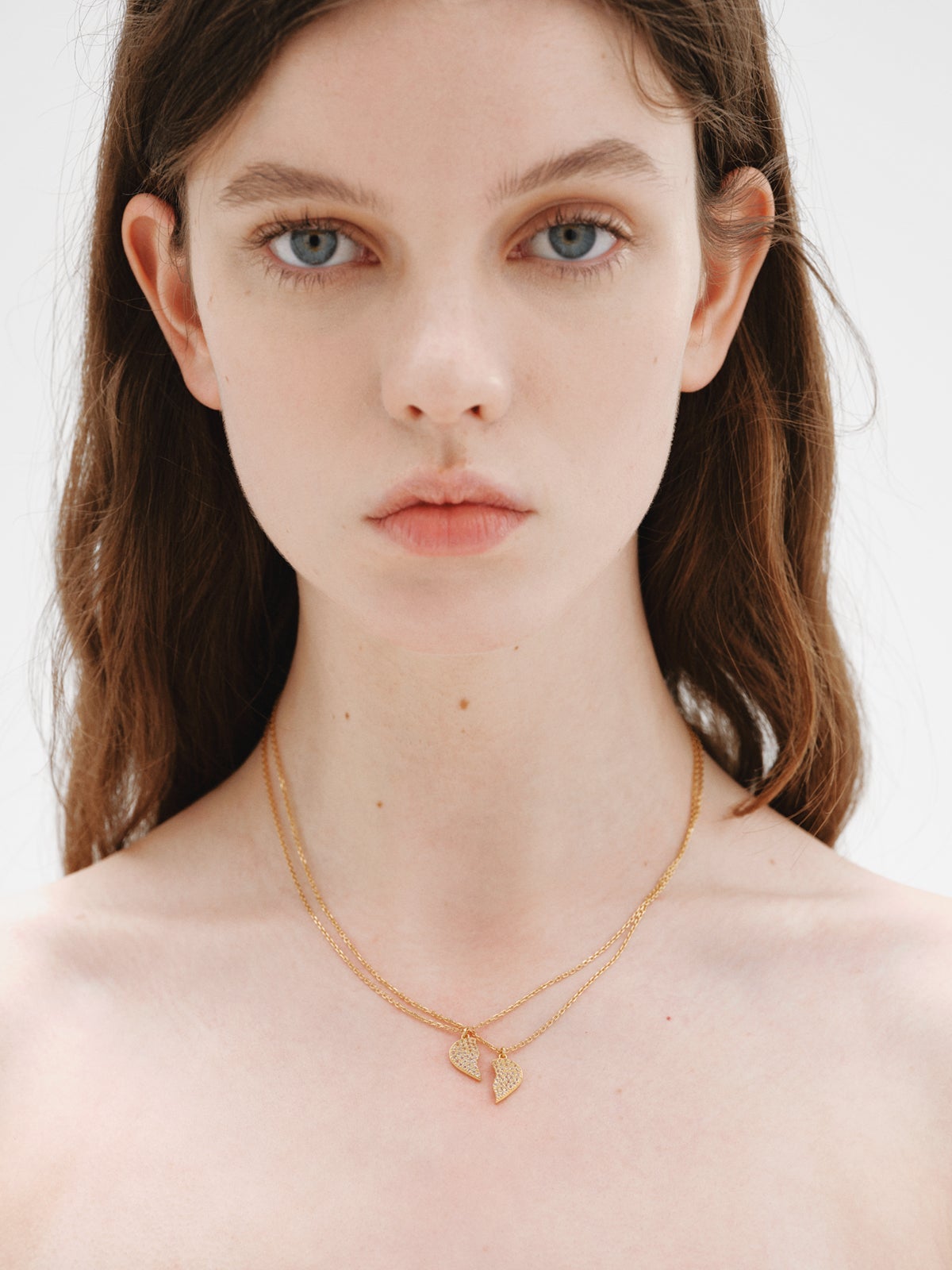 18K yellow gold plated silver pendant, white topaz and split heart shape