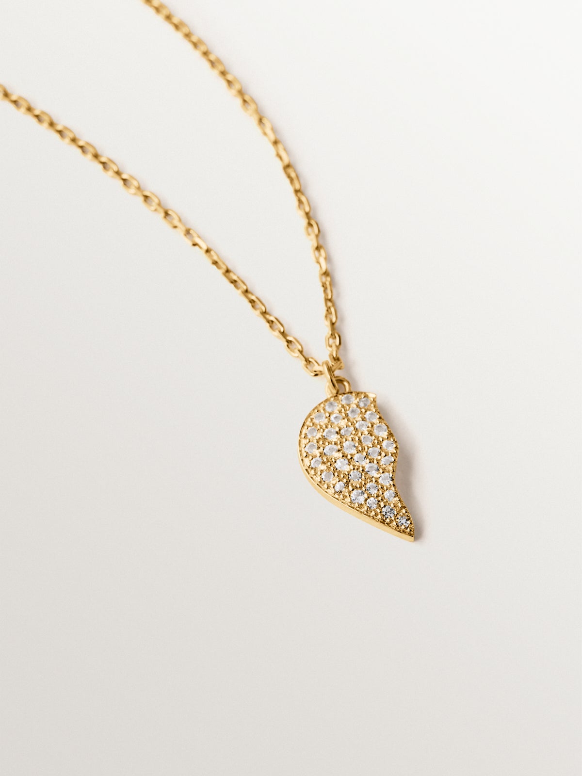 18K yellow gold plated silver pendant, white topaz and split heart shape