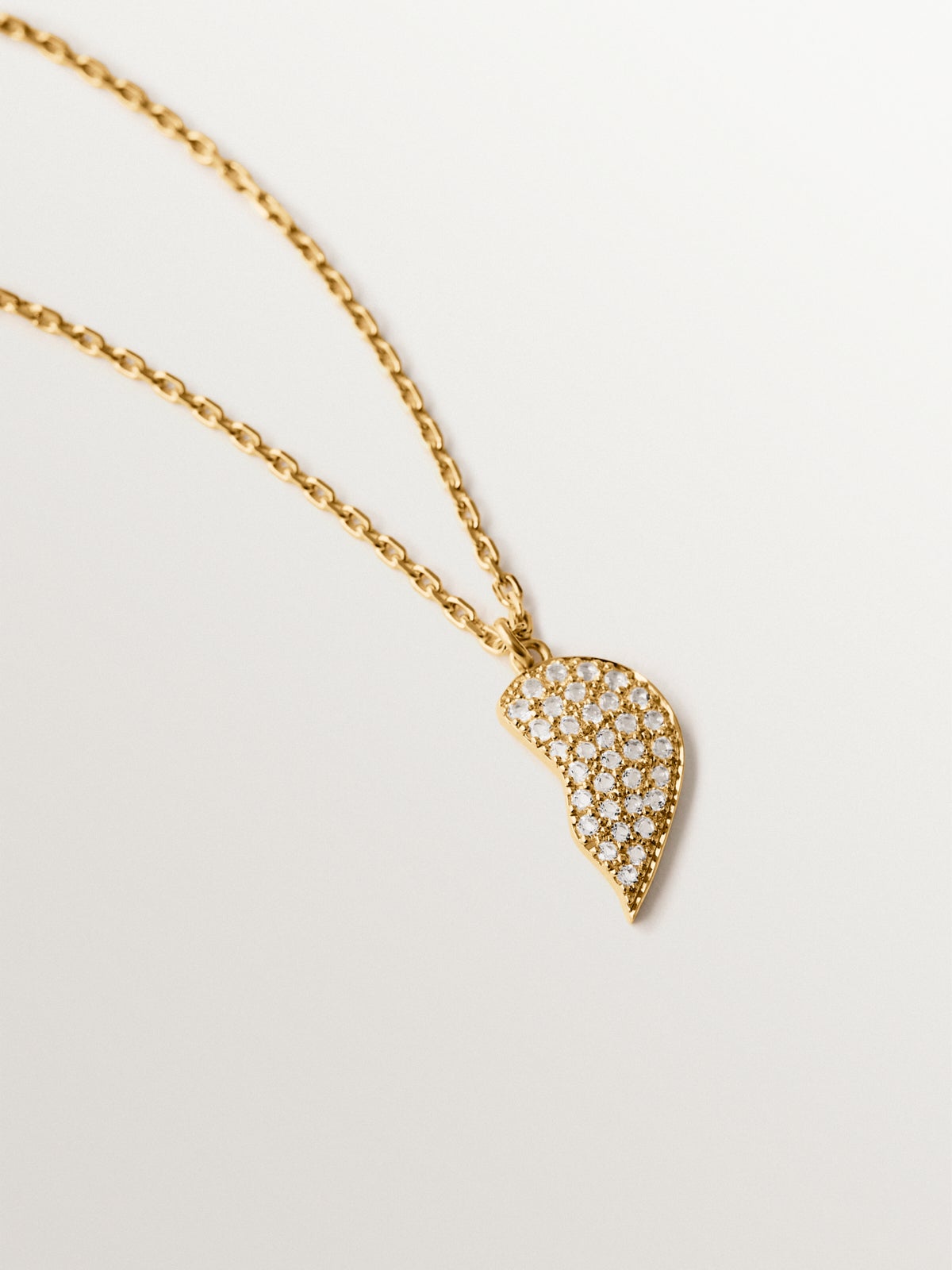18K yellow gold plated silver pendant, white topaz and split heart shape