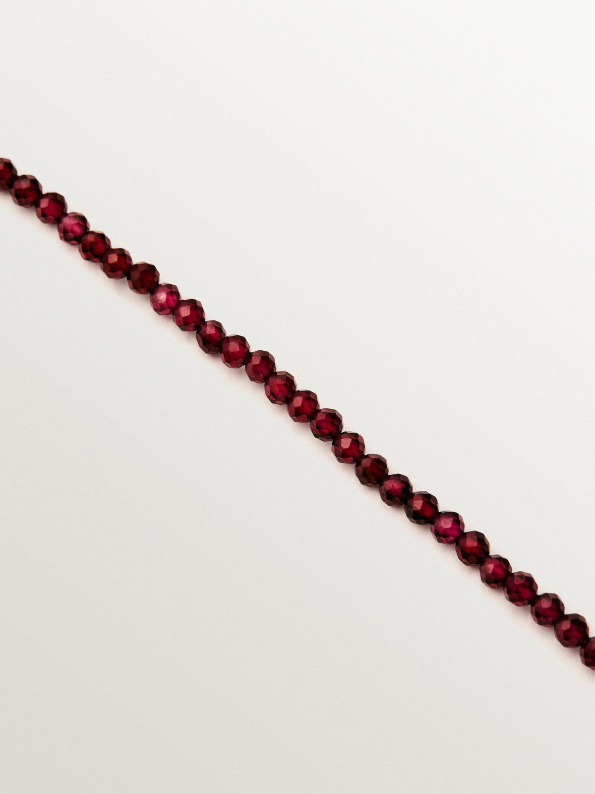 18K yellow gold plated silver necklace with garnet beads and heart motifs