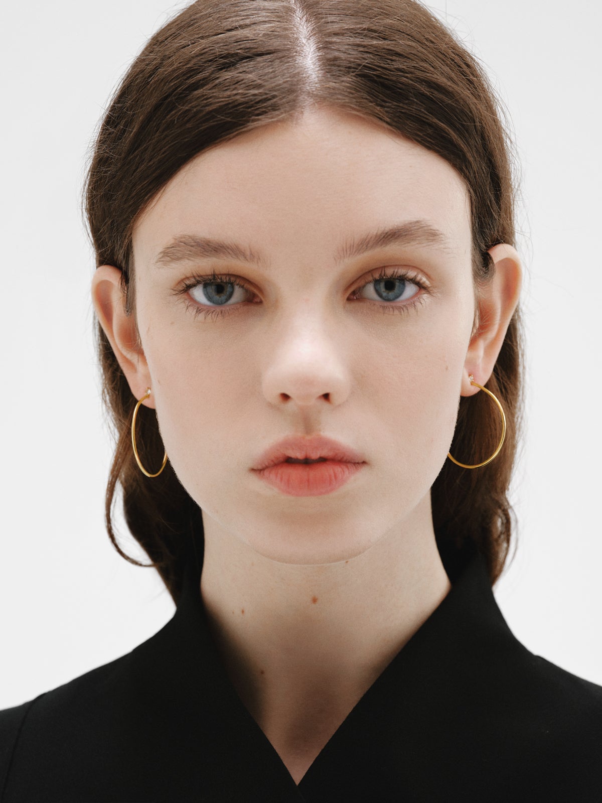 Large hoop earrings in 18K gold plated silver with white topaz