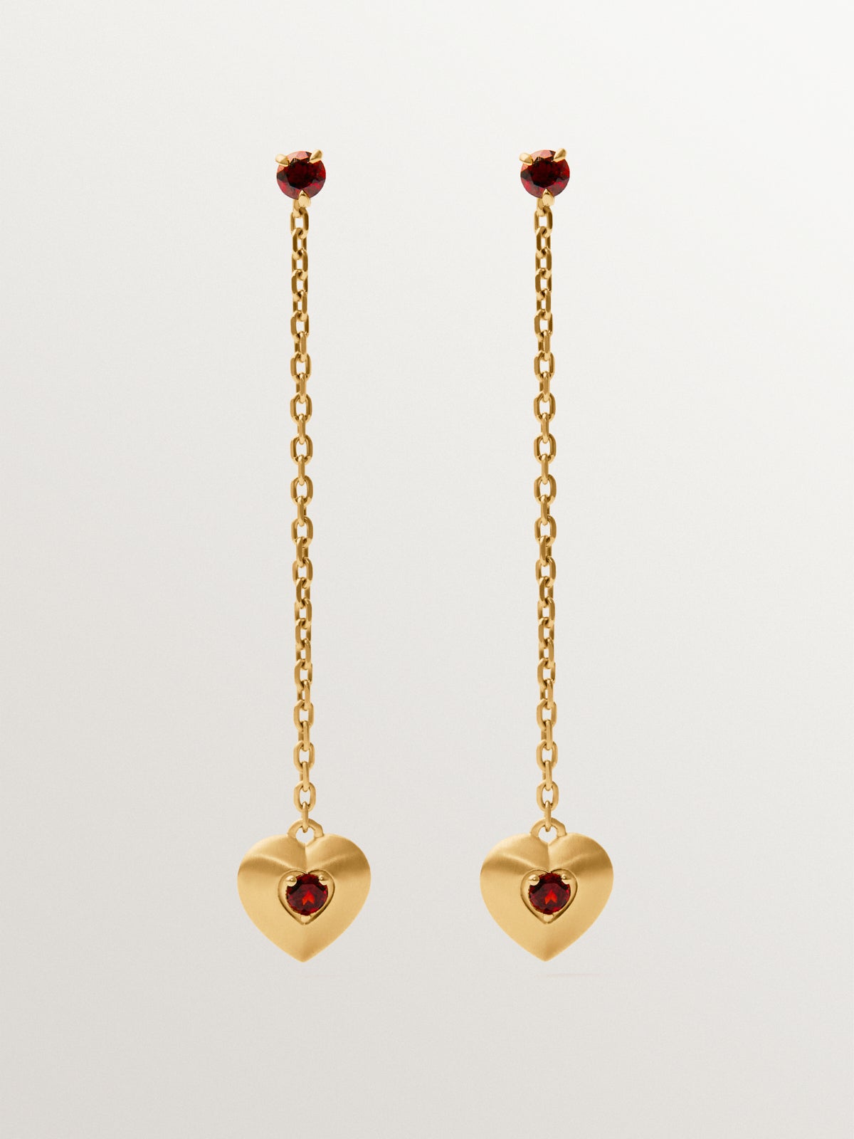 Long earrings in 18K yellow gold plated silver with red garnet beads, white topaz and heart shape