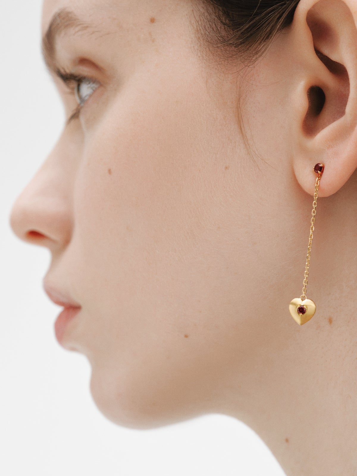 Long earrings in 18K yellow gold plated silver with red garnet beads, white topaz and heart shape