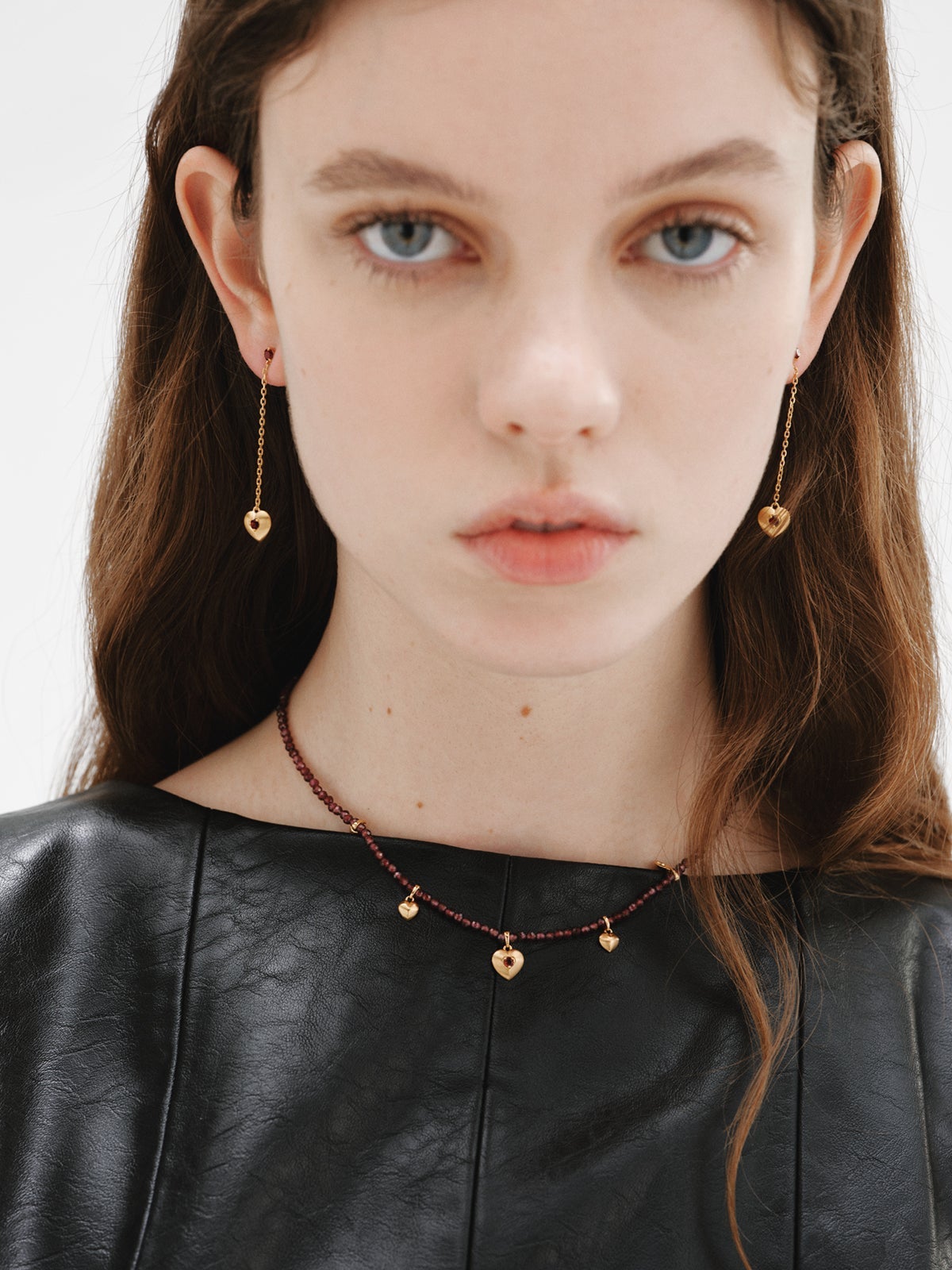 Long earrings in 18K yellow gold plated silver with red garnet beads, white topaz and heart shape