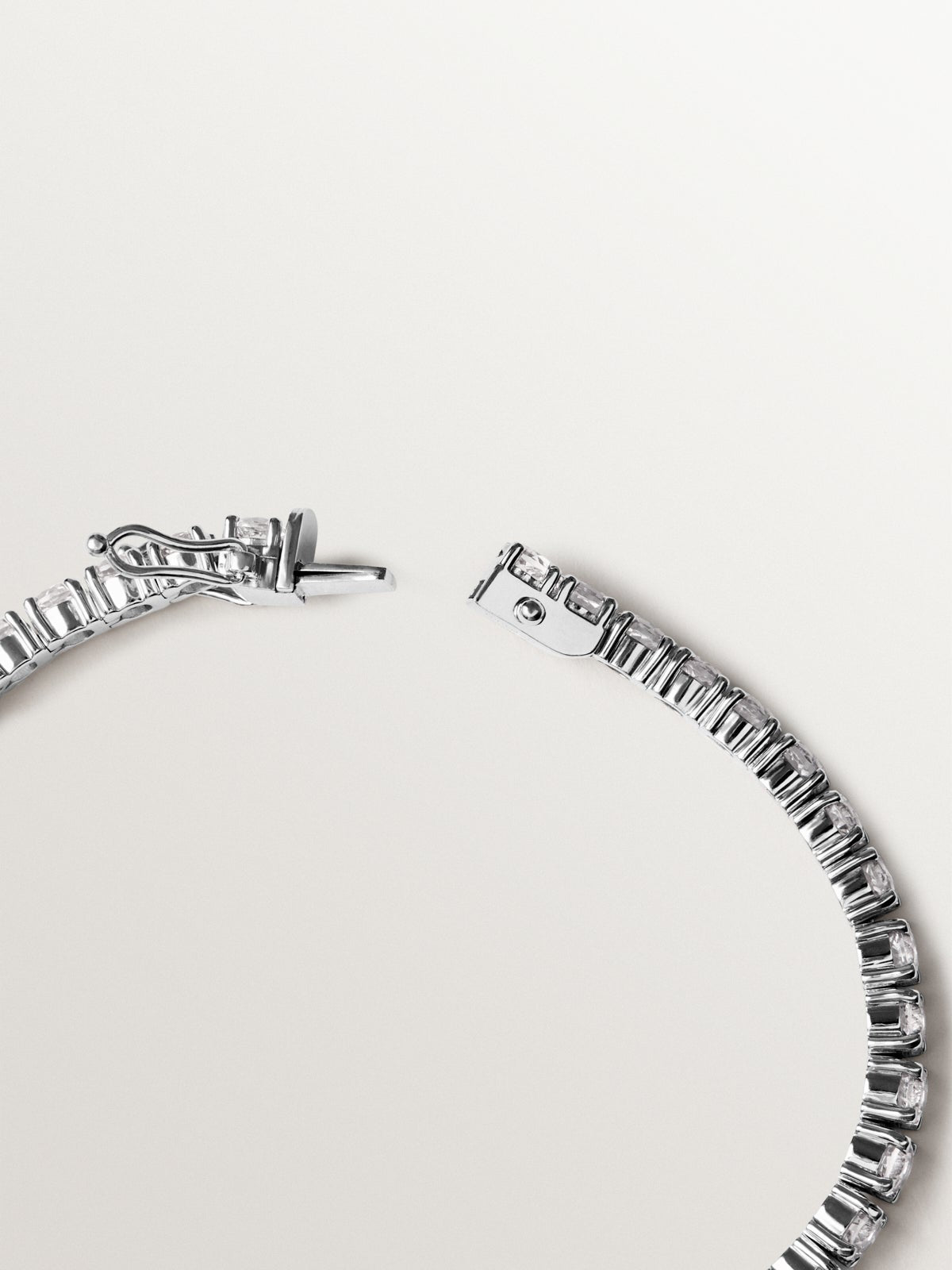 Thick rivière bracelet in 925 silver with white topaz