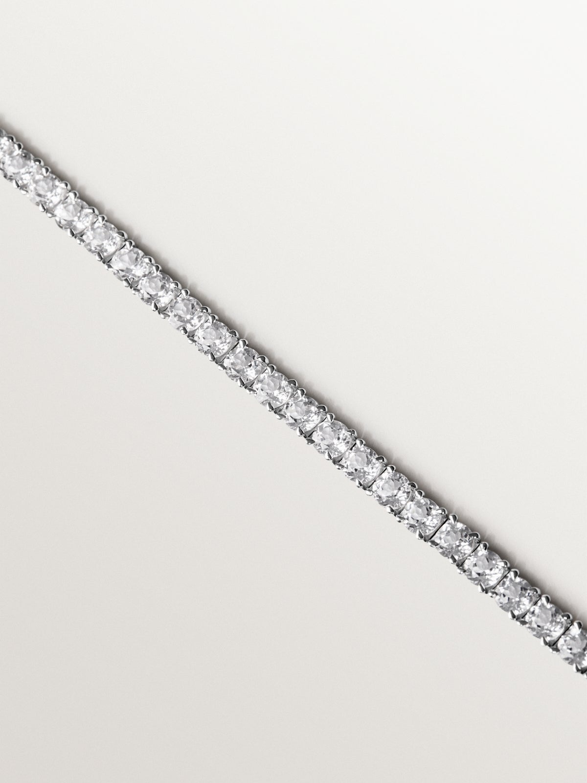 Thick rivière bracelet in 925 silver with white topaz