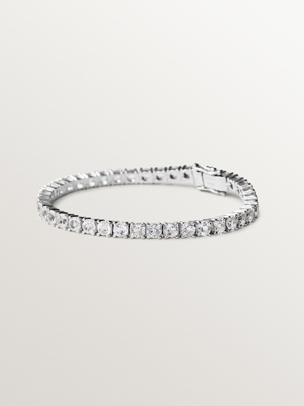 Thick rivière bracelet in 925 silver with white topaz