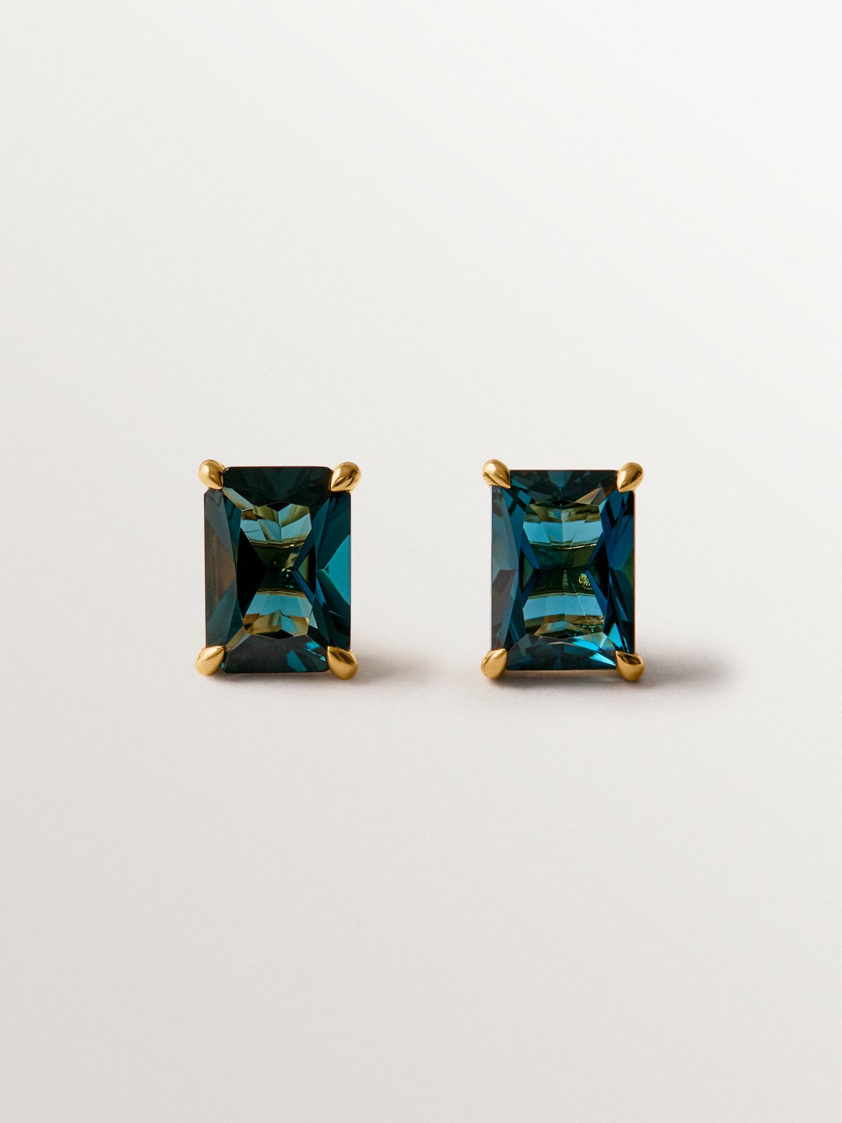 925 silver earrings plated in 18K yellow gold with London blue topaz