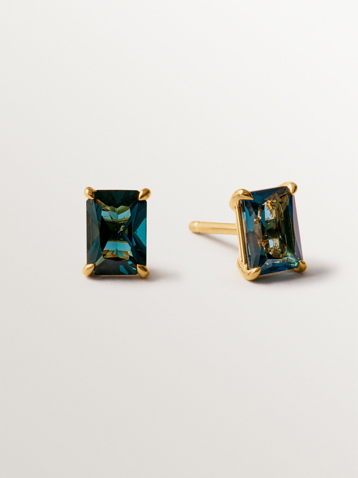 925 silver earrings plated in 18K yellow gold with London blue topaz