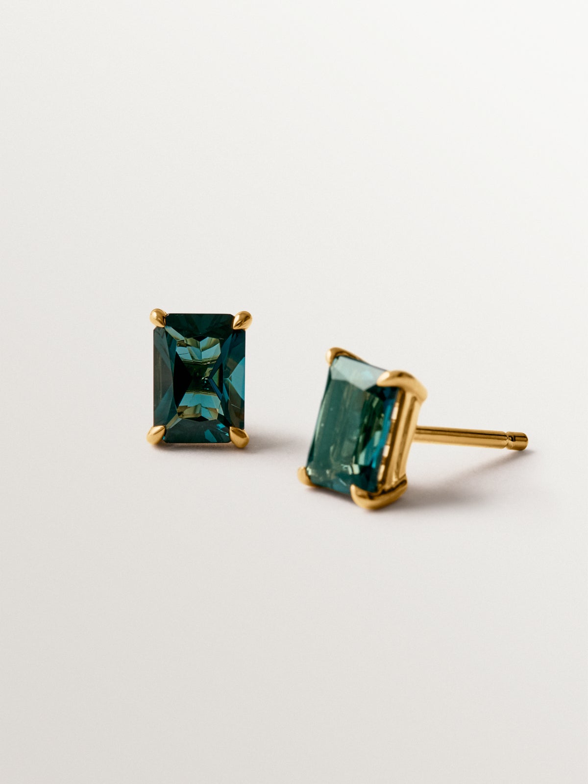 925 silver earrings plated in 18K yellow gold with London blue topaz