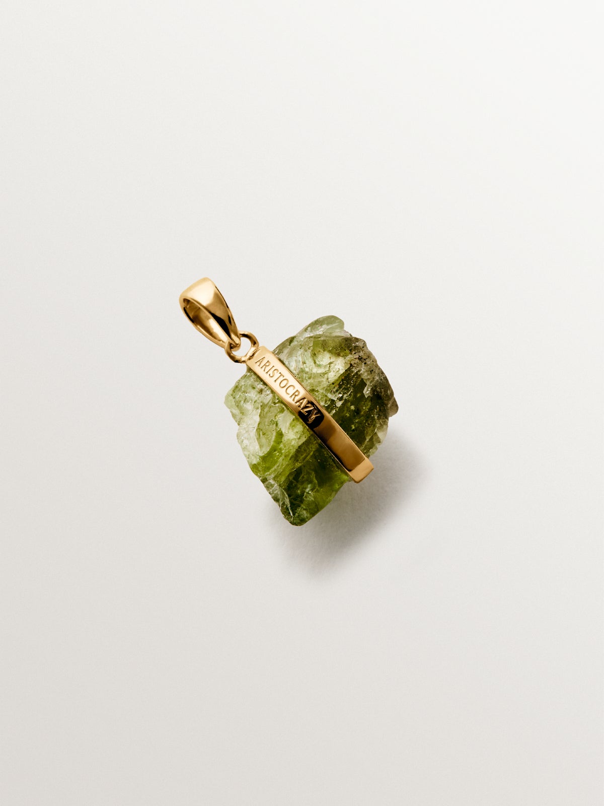 August birthstone charm with green peridot
