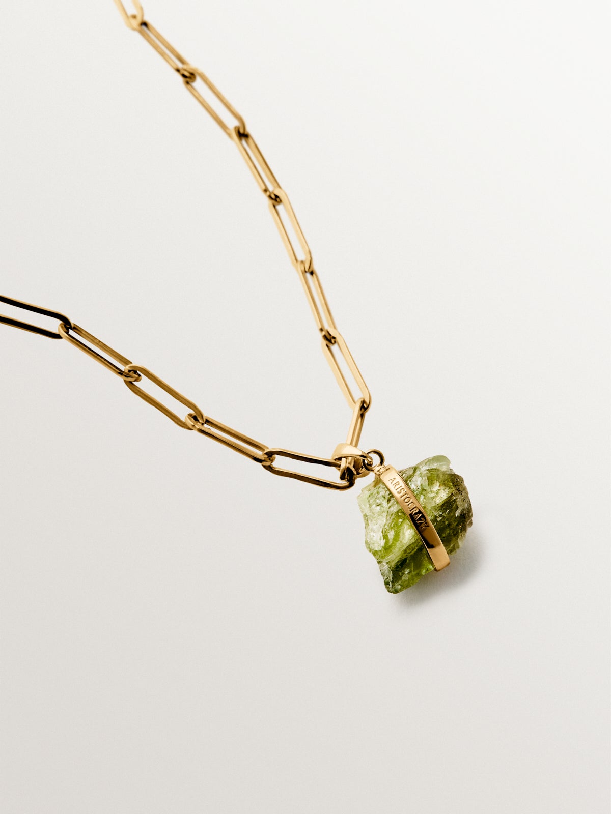 August birthstone charm with green peridot