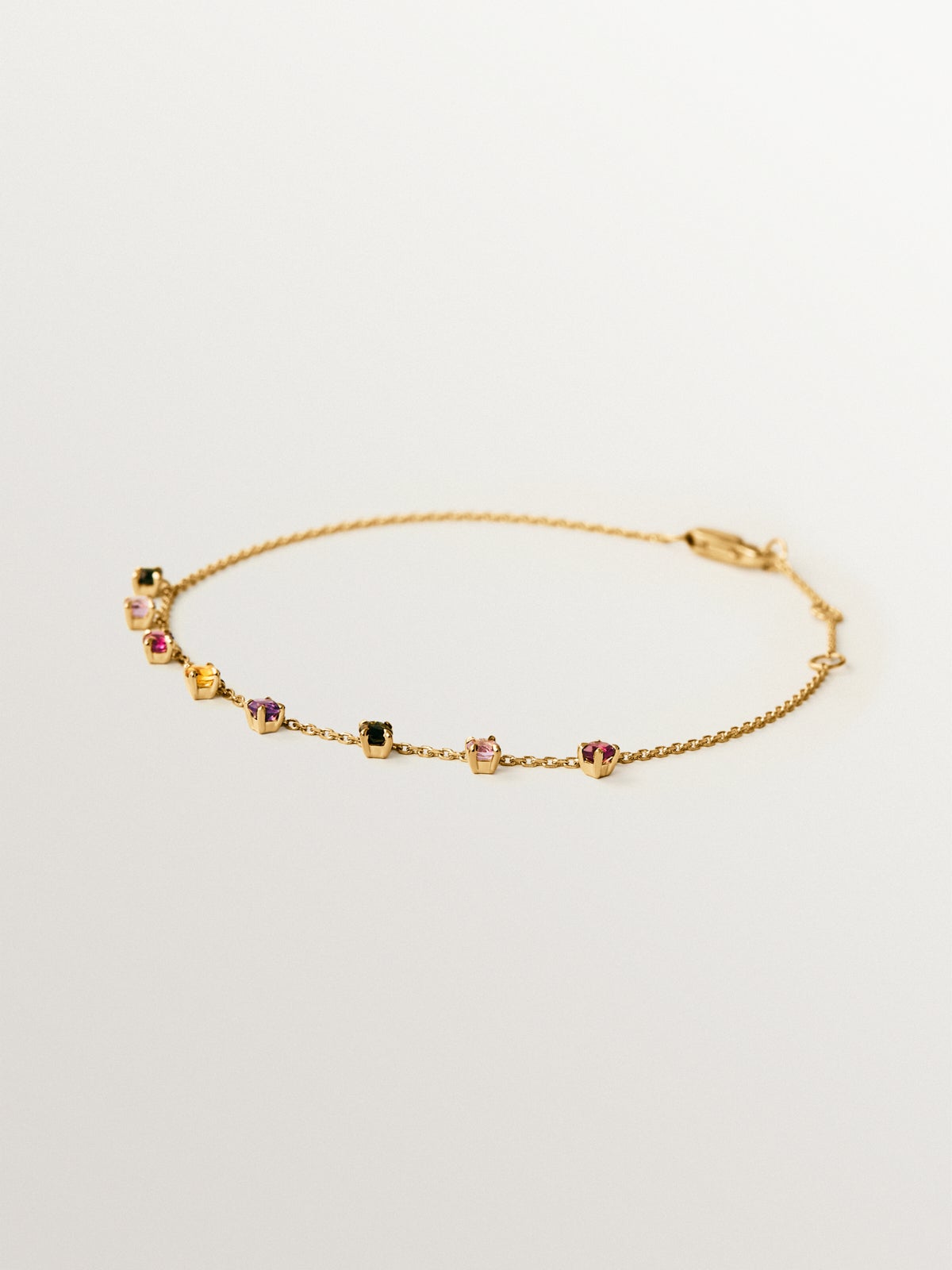 9K yellow gold bracelet with pink and black amethysts, green tourmalines, orange citrine and rhodoliths