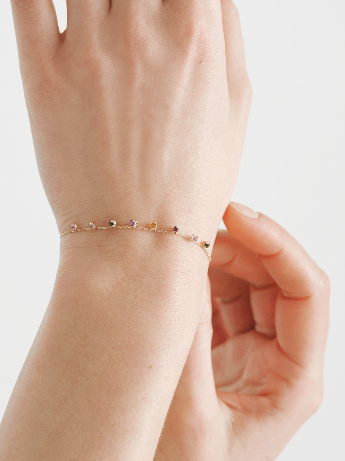 9K yellow gold bracelet with pink and black amethysts, green tourmalines, orange citrine and rhodoliths