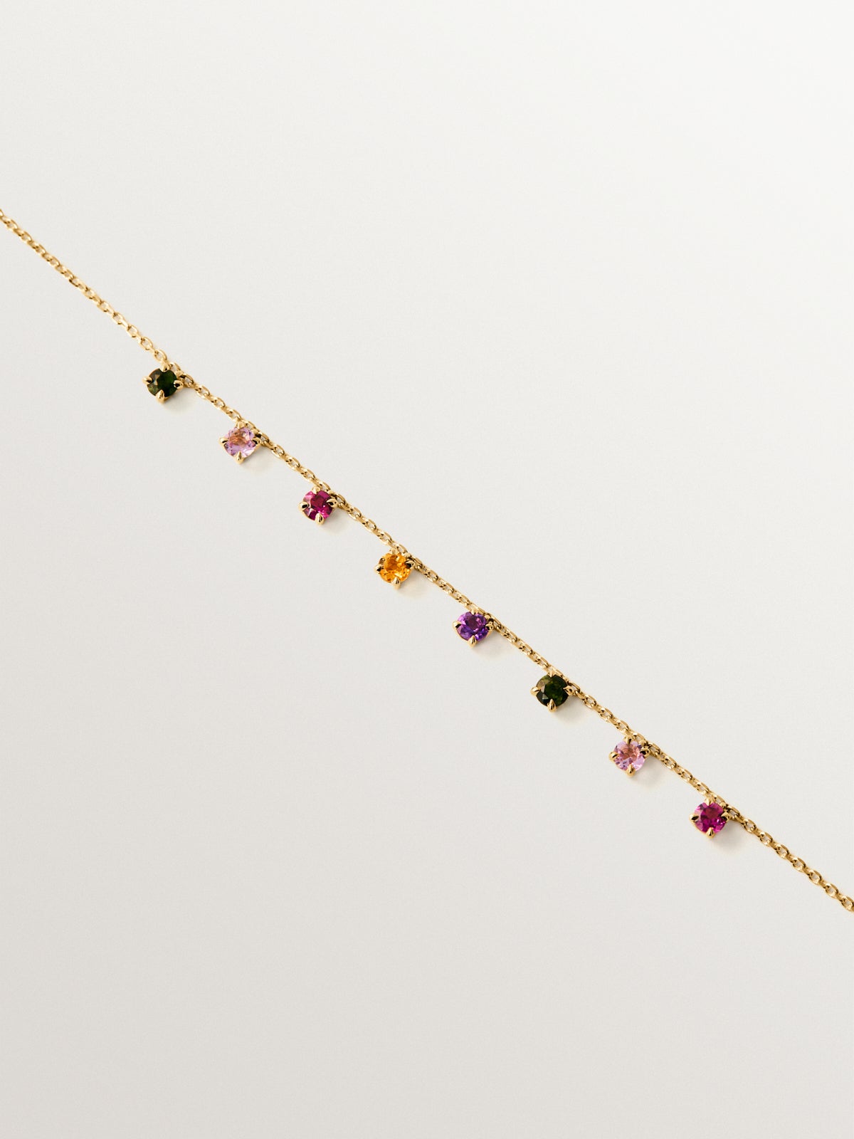 9K yellow gold bracelet with pink and black amethysts, green tourmalines, orange citrine and rhodoliths