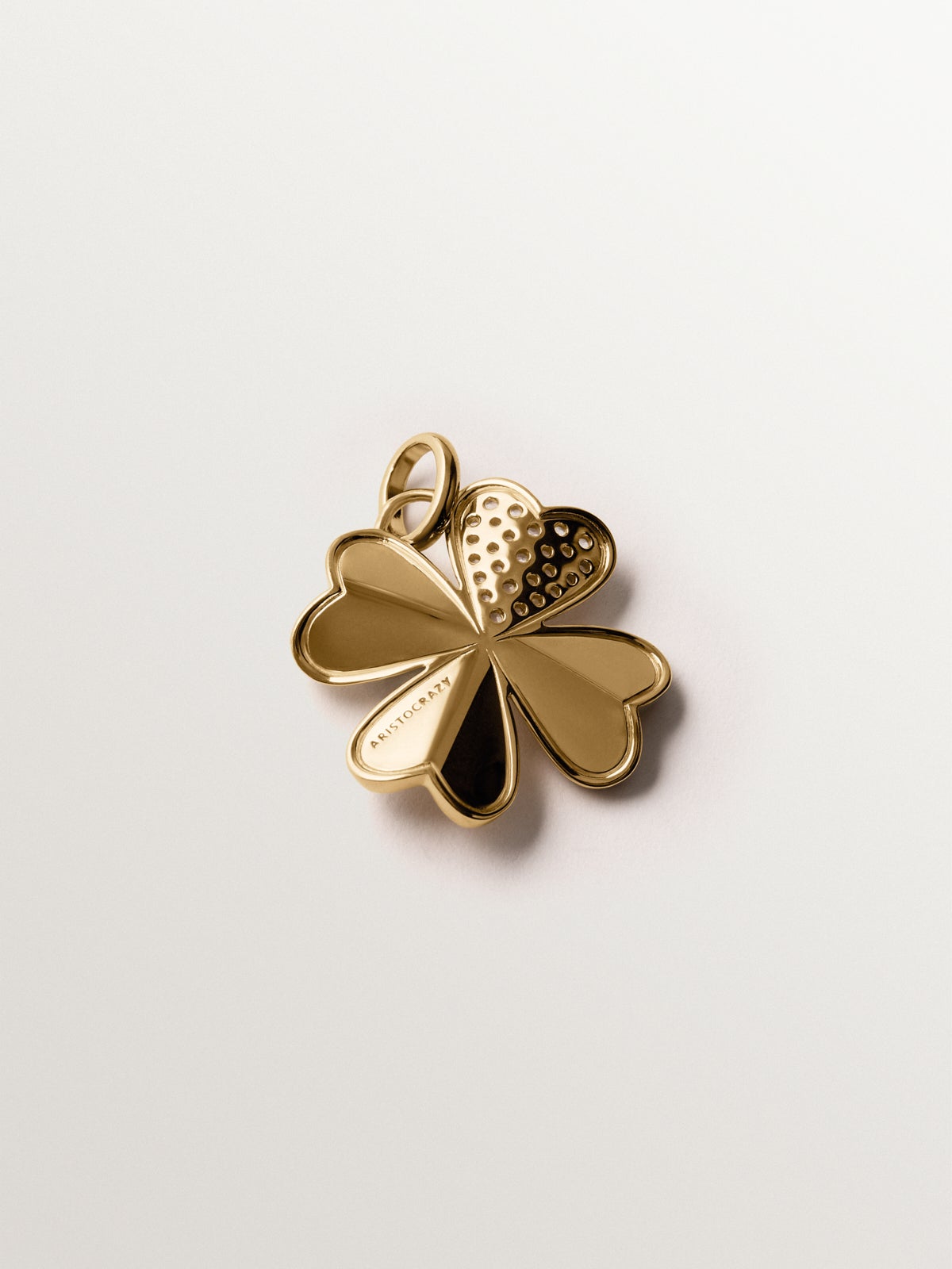 925 silver charm plated in 18K yellow gold with white topaz and clover shape