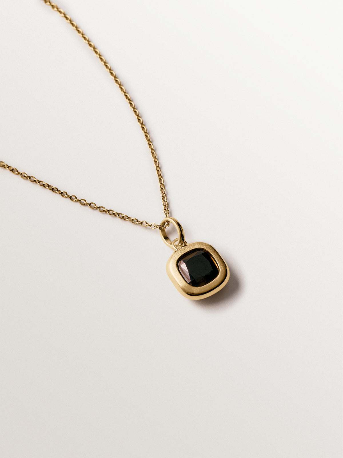 925 silver charm plated in 18K yellow gold with black topaz