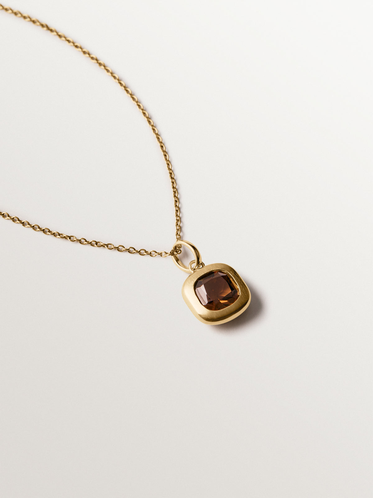 925 silver charm plated in 18K yellow gold with brown topaz