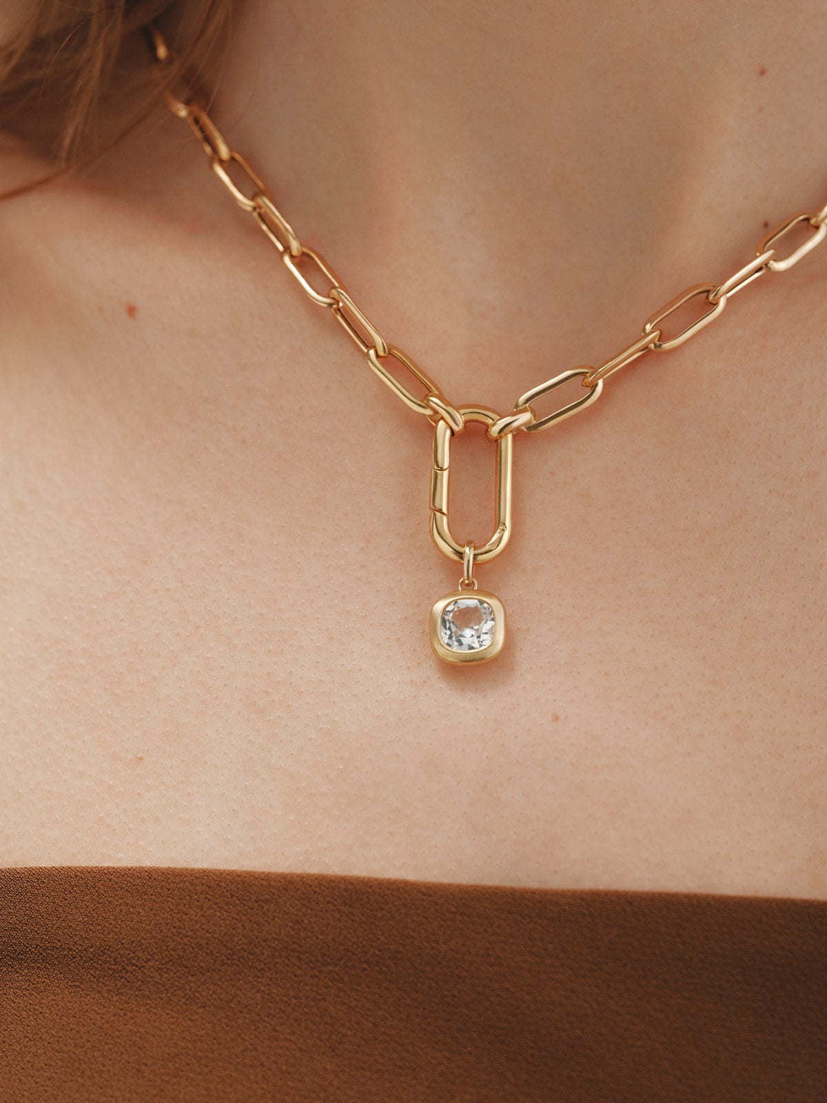925 silver charm plated in 18K yellow gold with sky blue topaz