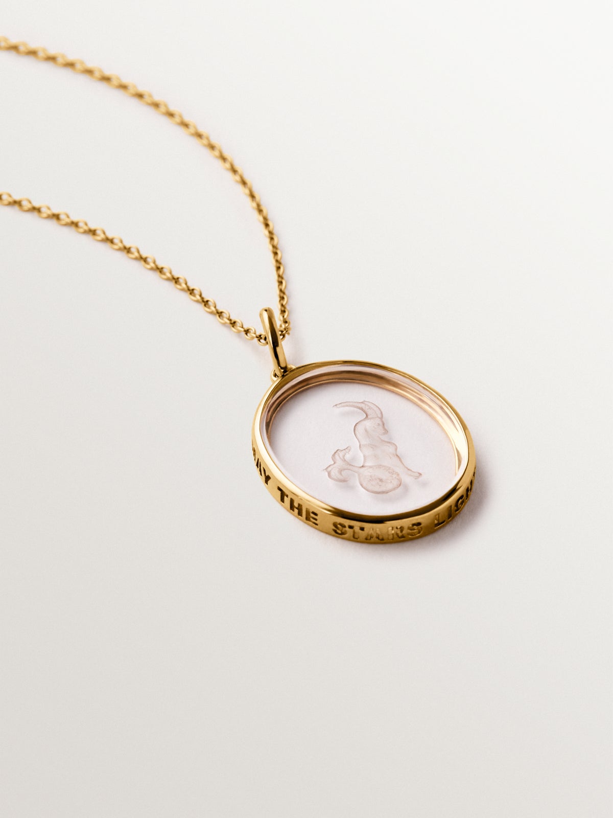 Carpricorn charm in 925 silver plated in 18K yellow gold and rock crystal