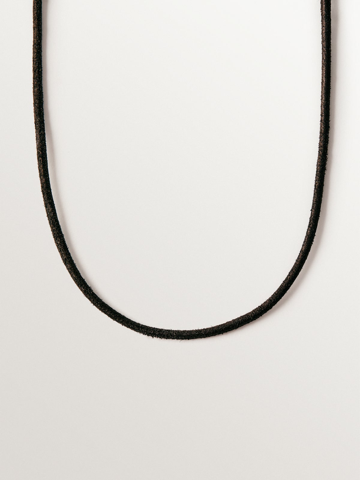Plain black leather cord with 925 silver finishes plated in 18K yellow gold