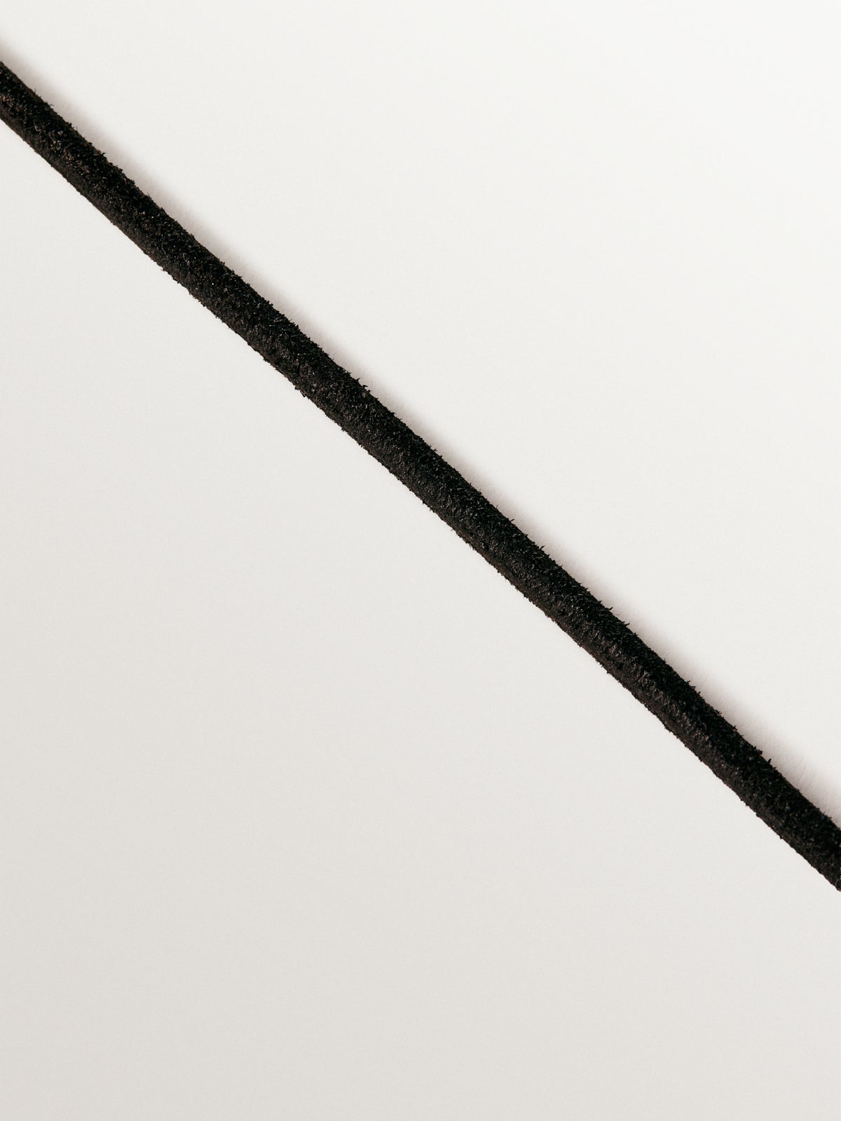 Plain black leather cord with 925 silver finishes plated in 18K yellow gold