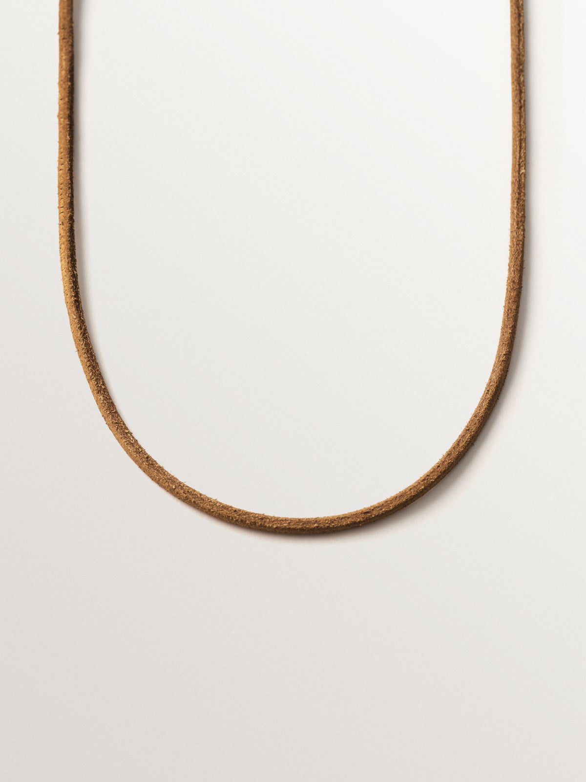 Smooth brown leather twine with 925 silver finishes plated in 18K yellow gold