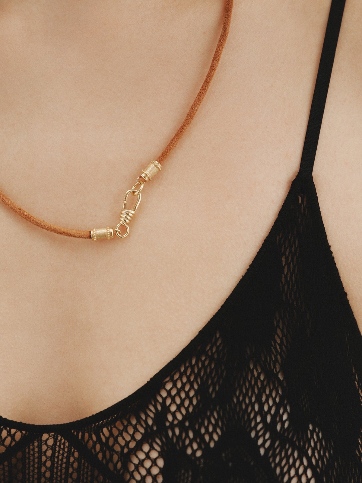Smooth brown leather twine with 925 silver finishes plated in 18K yellow gold