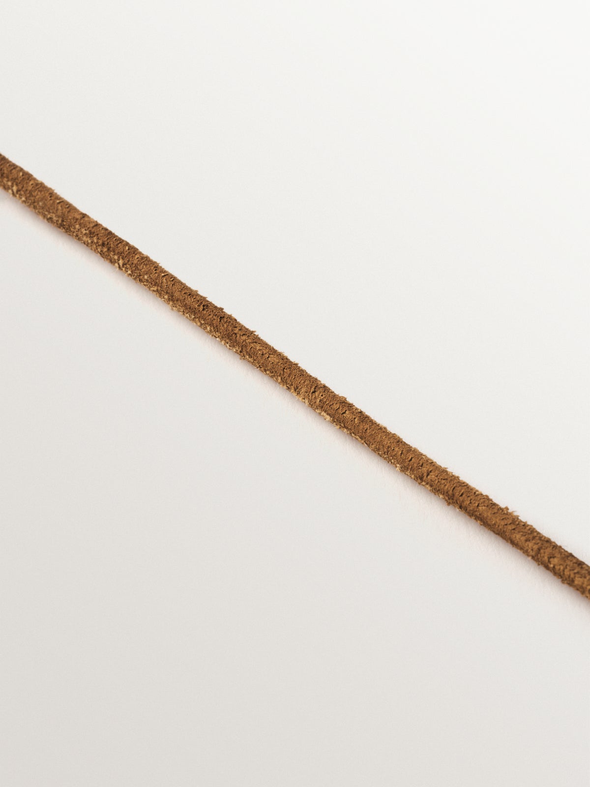 Smooth brown leather twine with 925 silver finishes plated in 18K yellow gold