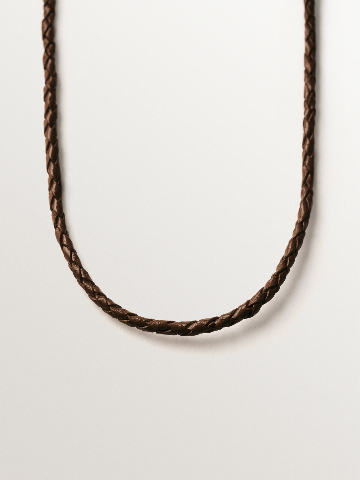 Brown leather braided twine with 925 silver finishes plated in 18K yellow gold