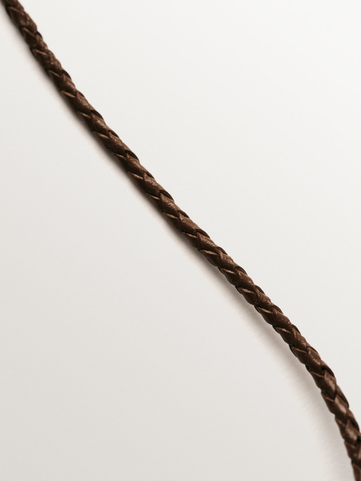 Brown leather braided twine with 925 silver finishes plated in 18K yellow gold