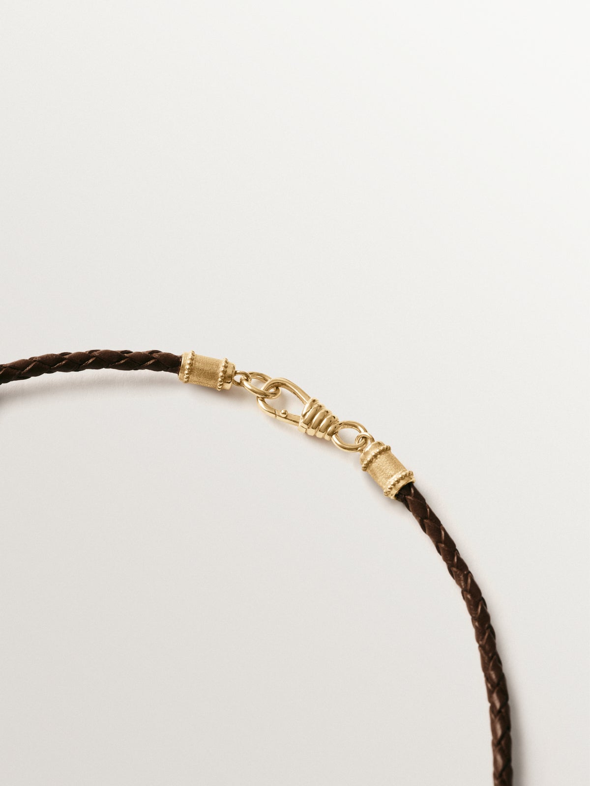 Brown leather braided twine with 925 silver finishes plated in 18K yellow gold