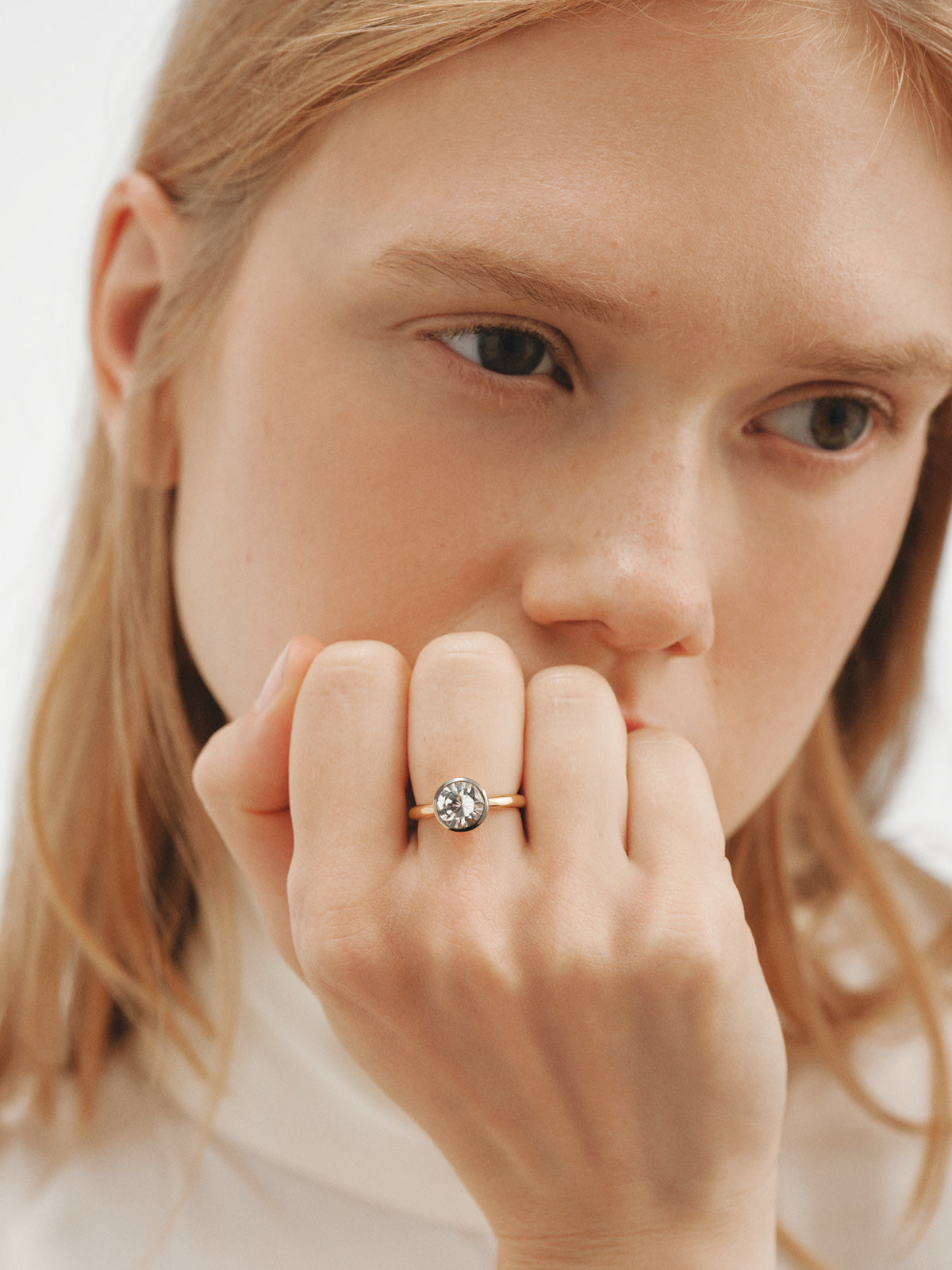 Two-tone 925 silver ring plated in 18K yellow gold with white topaz