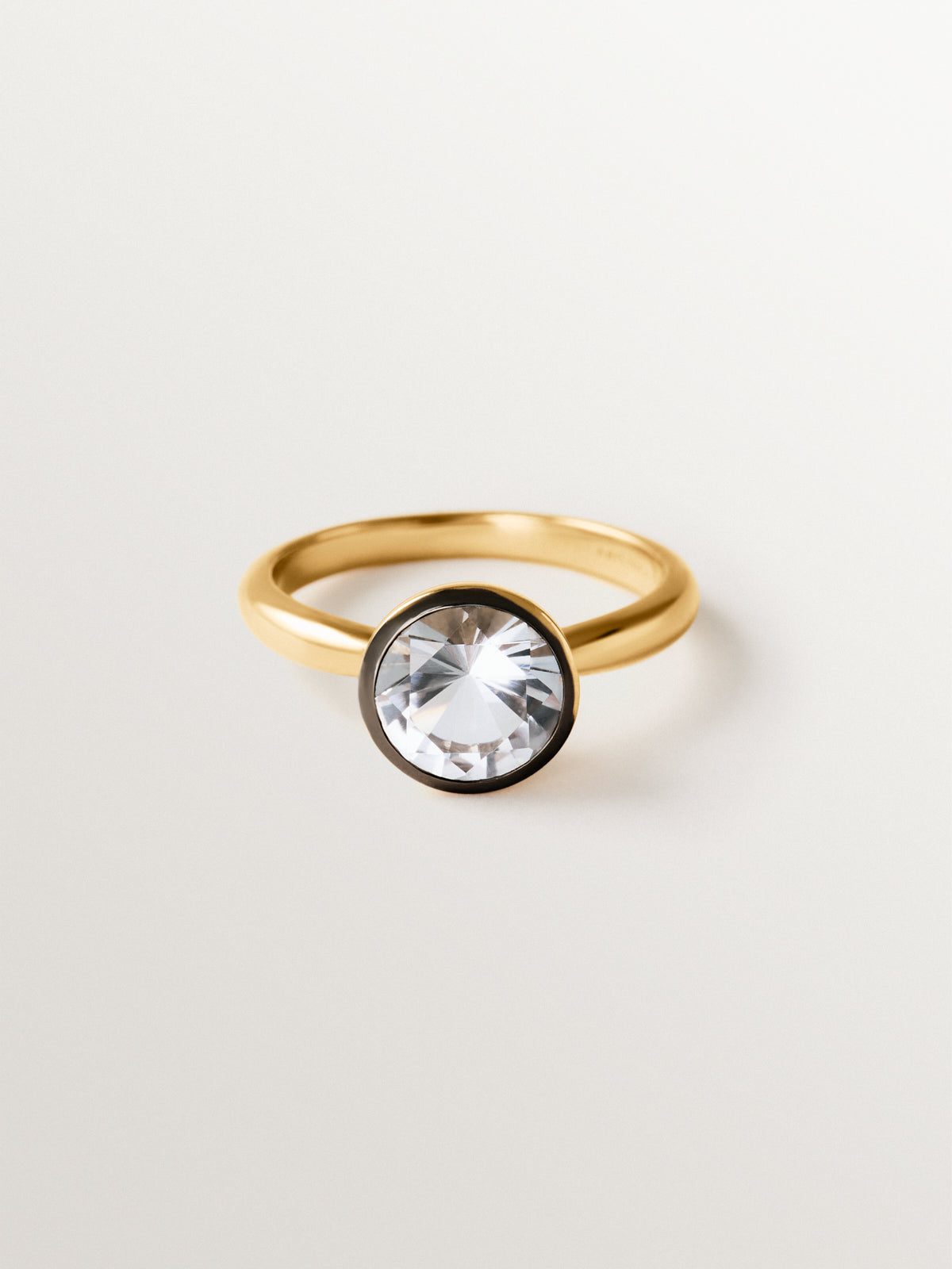 Two-tone 925 silver ring plated in 18K yellow gold with white topaz