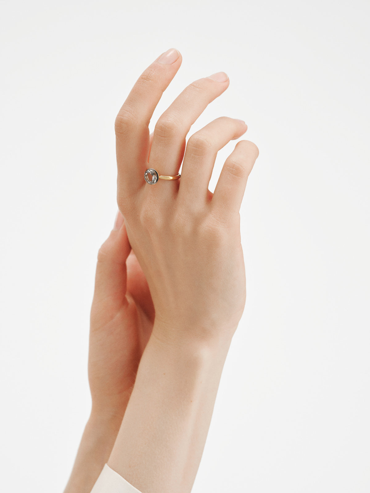Two-tone 925 silver ring plated in 18K yellow gold with white topaz